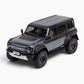 Traction Hobby 1/8 Ford Bronco Raptor in Grey, front three-quarter studio view