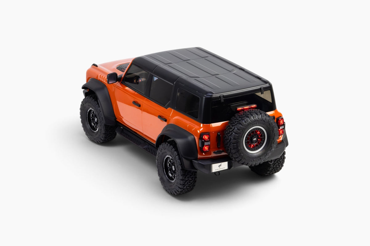 Traction Hobby 1/8 Ford Bronco Raptor in Orange, rear three-quarter studio view